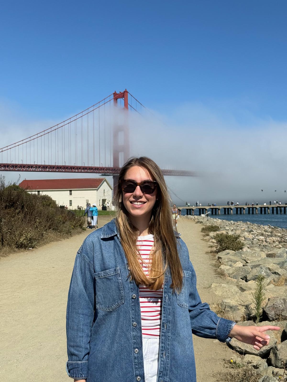Lilien pointing at the fog over the Golden Gate Bridge