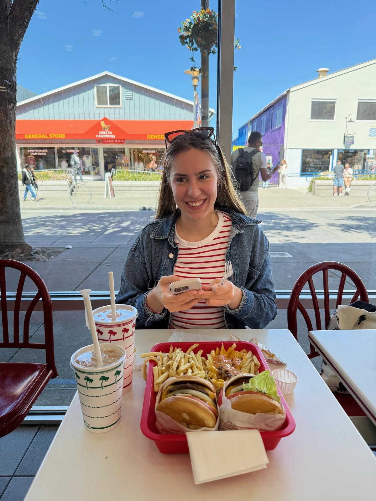 Lilien at In-N-Out with a tray of burgers and fries