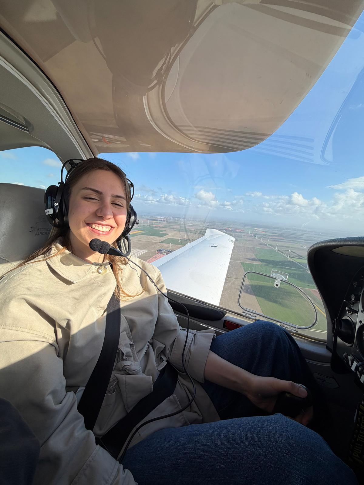 Lilien at the controls of a small plane during a flying lesson