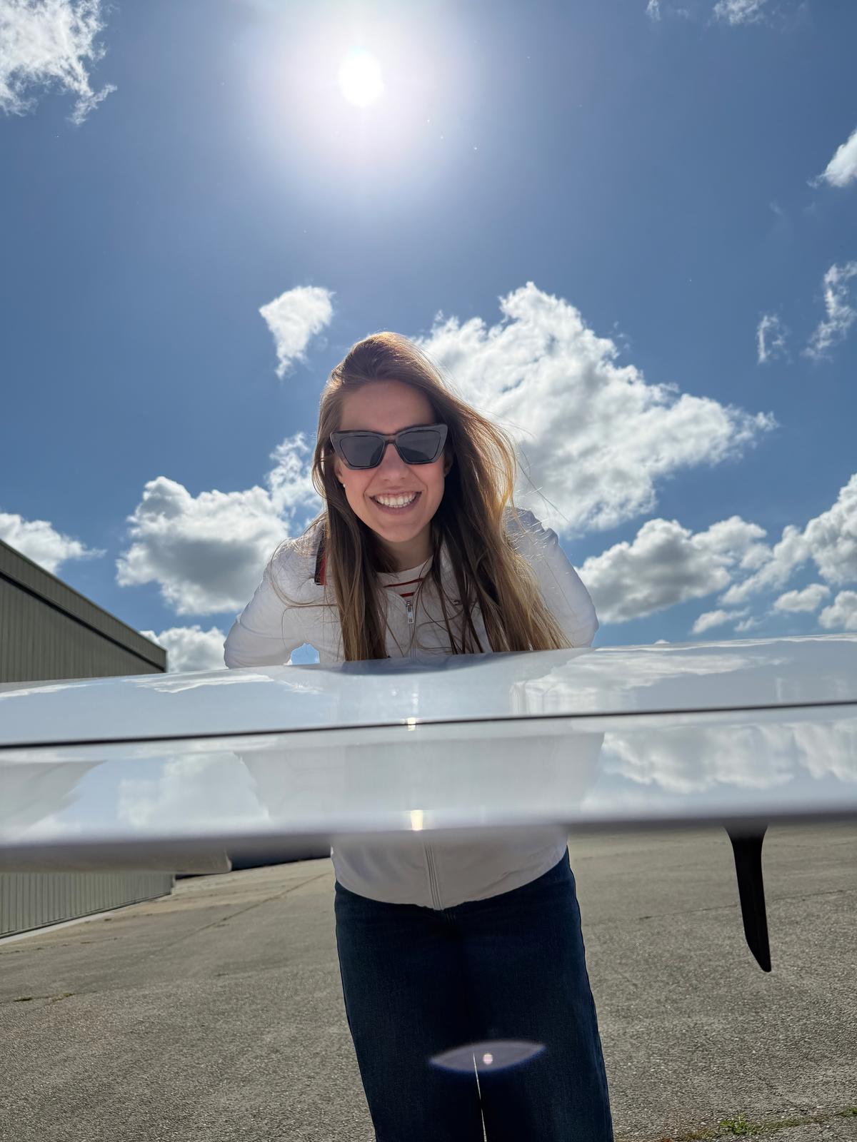 Lilien leaning over the wing before flight