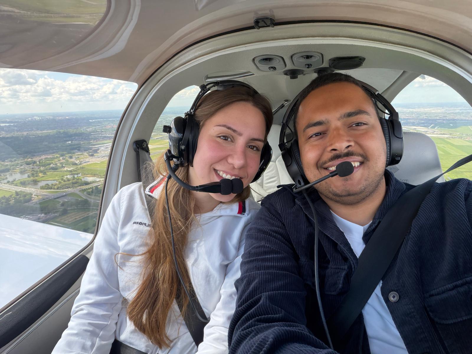 Lilien and Zeyad in the cockpit mid-flight